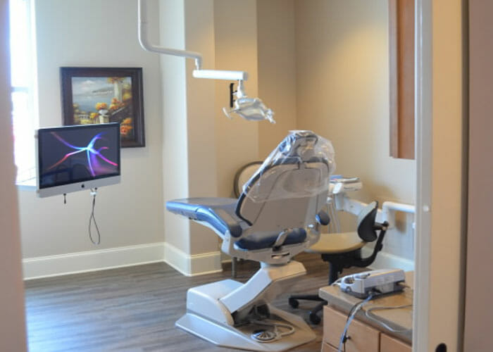 A dental office chair and equipment at Triangle Family Dentistry (Fuquay-Varina)