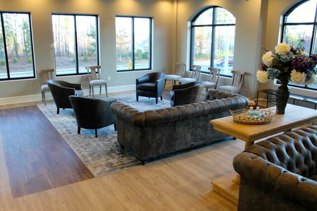 The waiting area of Triangle Family Dentistry (Cary Park) with couches and chairs