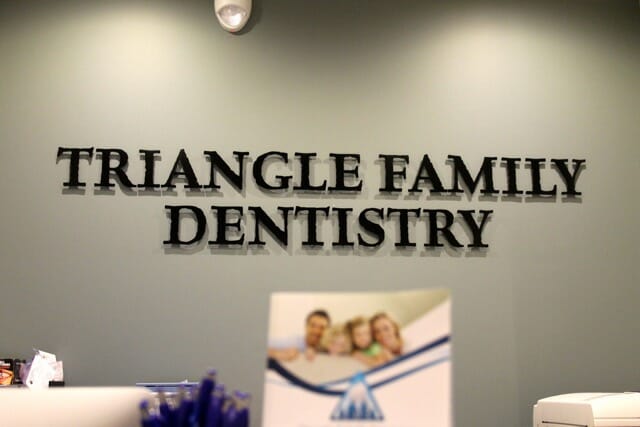 Front desk signage at Triangle Family Dentistry (Cary Park)