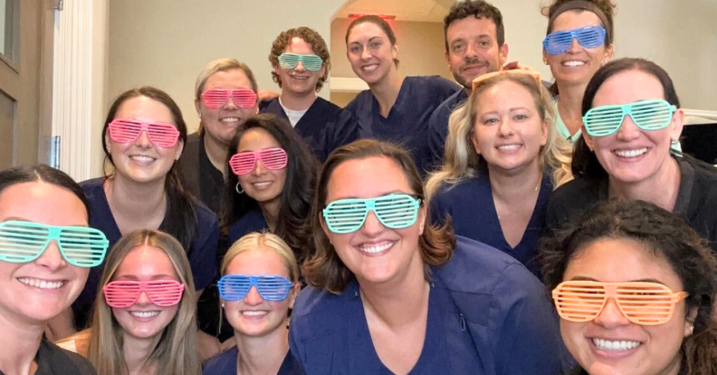 The team of Triangle Family Dentistry with shutter shade glasses