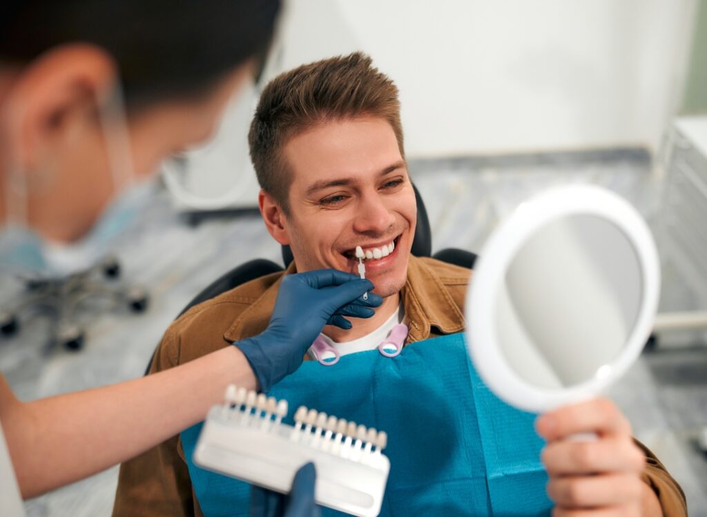 patient choosing a color for their dental veneers